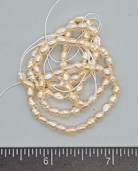 Warm White With A Warm Apricot Cast Baroque Genuine Cultured Pearls